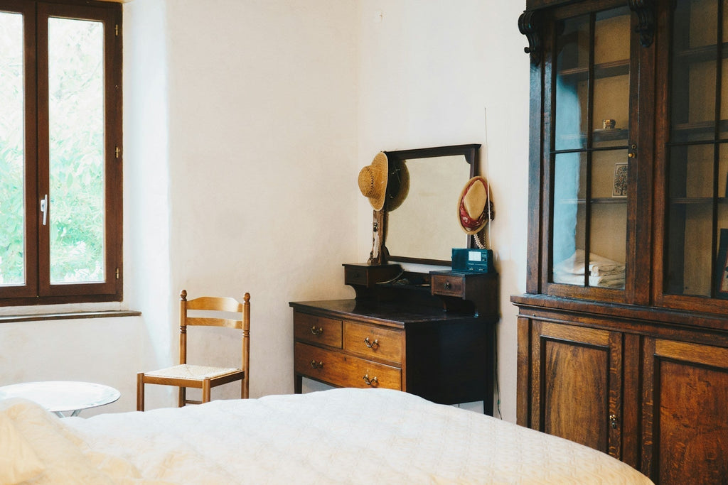 Neutral calm of hux and mu earthborne skincare, bedroom with waxed dresser and dressing table