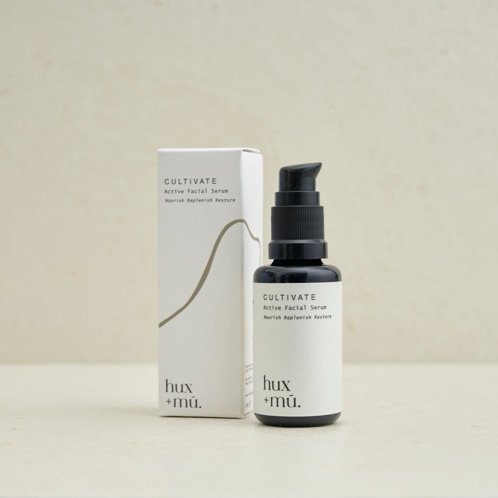 30 ml bottle of hux and mu cultivate active facial serum with box packaging in neutral setting